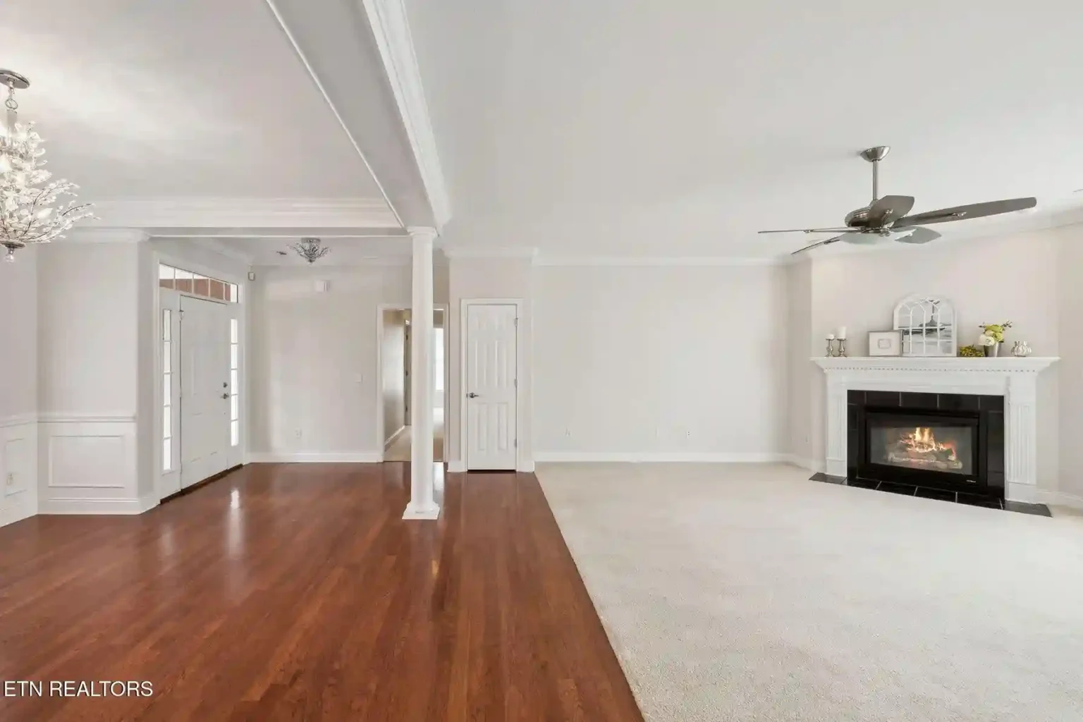 Interior painter using roller on living room wall Knoxville